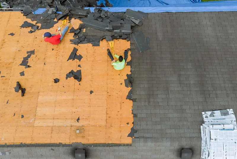 Roofing contractors from a Central Florida roofing company performing a tile roof replacement on a residential home, delivering elegant and durable residential roofing solutions with quality craftsmanship