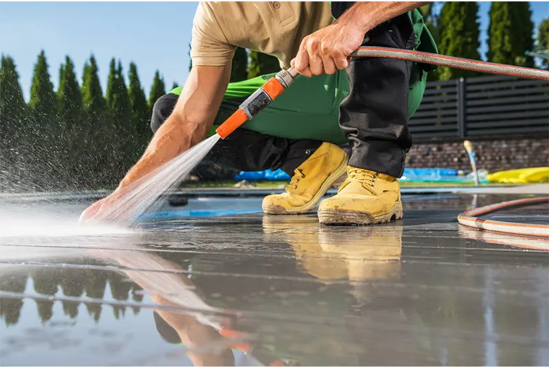 Roofing contractors from Sunstate Roofs performing commercial roof cleaning services to maintain and protect business properties in Central Florida.