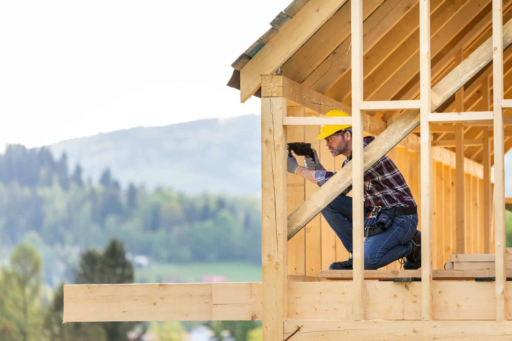 A roofing contractor from Sunstate Roofs working on the wooden framework of a residential roofing project in Central Florida. Sunstate Roofs is a trusted roofing company specializing in residential and commercial roofing solutions as part of their professional projects