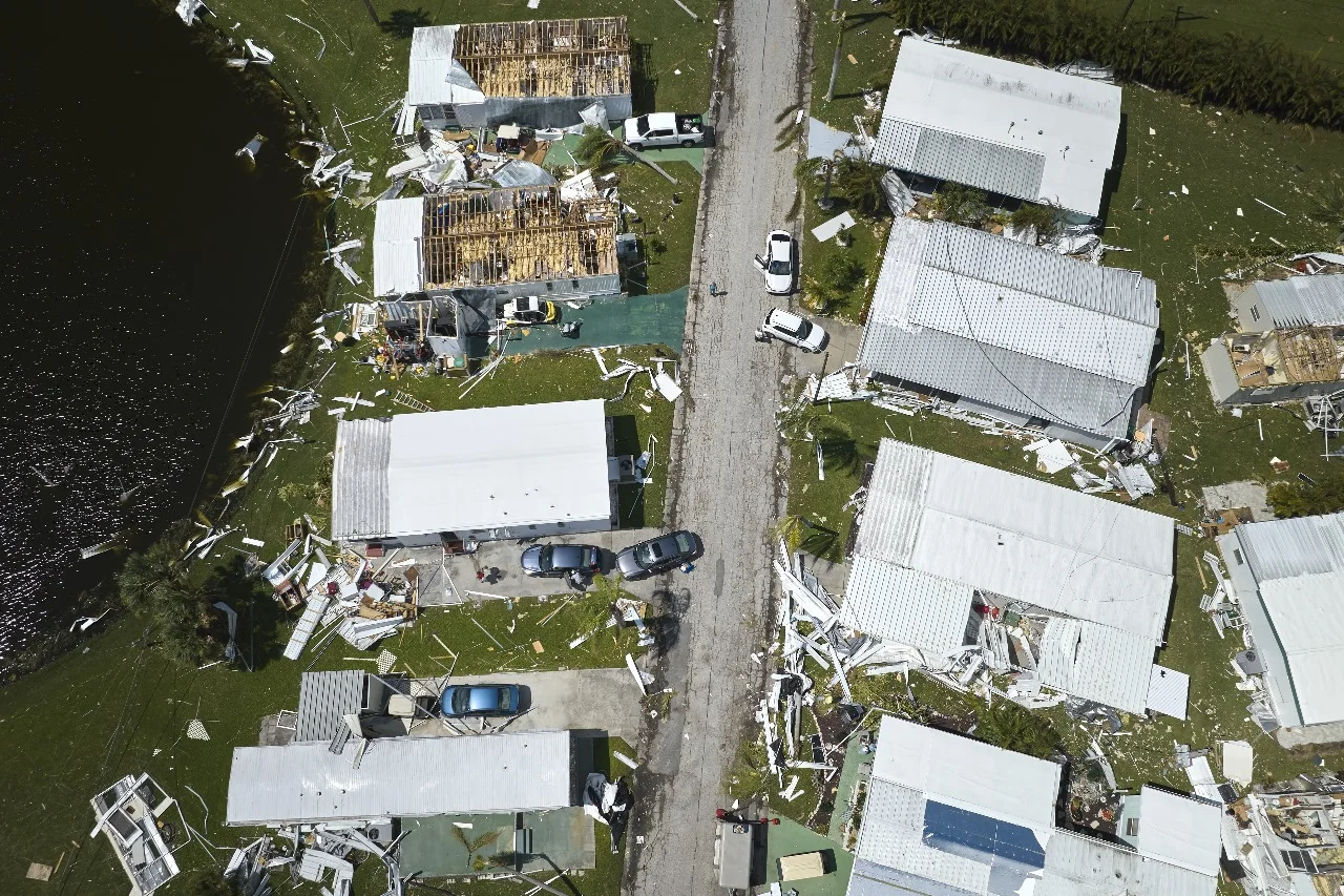 Aerial view of homes in Central Florida severely damaged by a storm, highlighting roofing problems like roof leaks and structural damage. Storm damage roof repair in Orlando is essential, with expert solutions provided by Sunstate Roofs Orlando, a trusted roofing contractor for roof maintenance and restoration.

