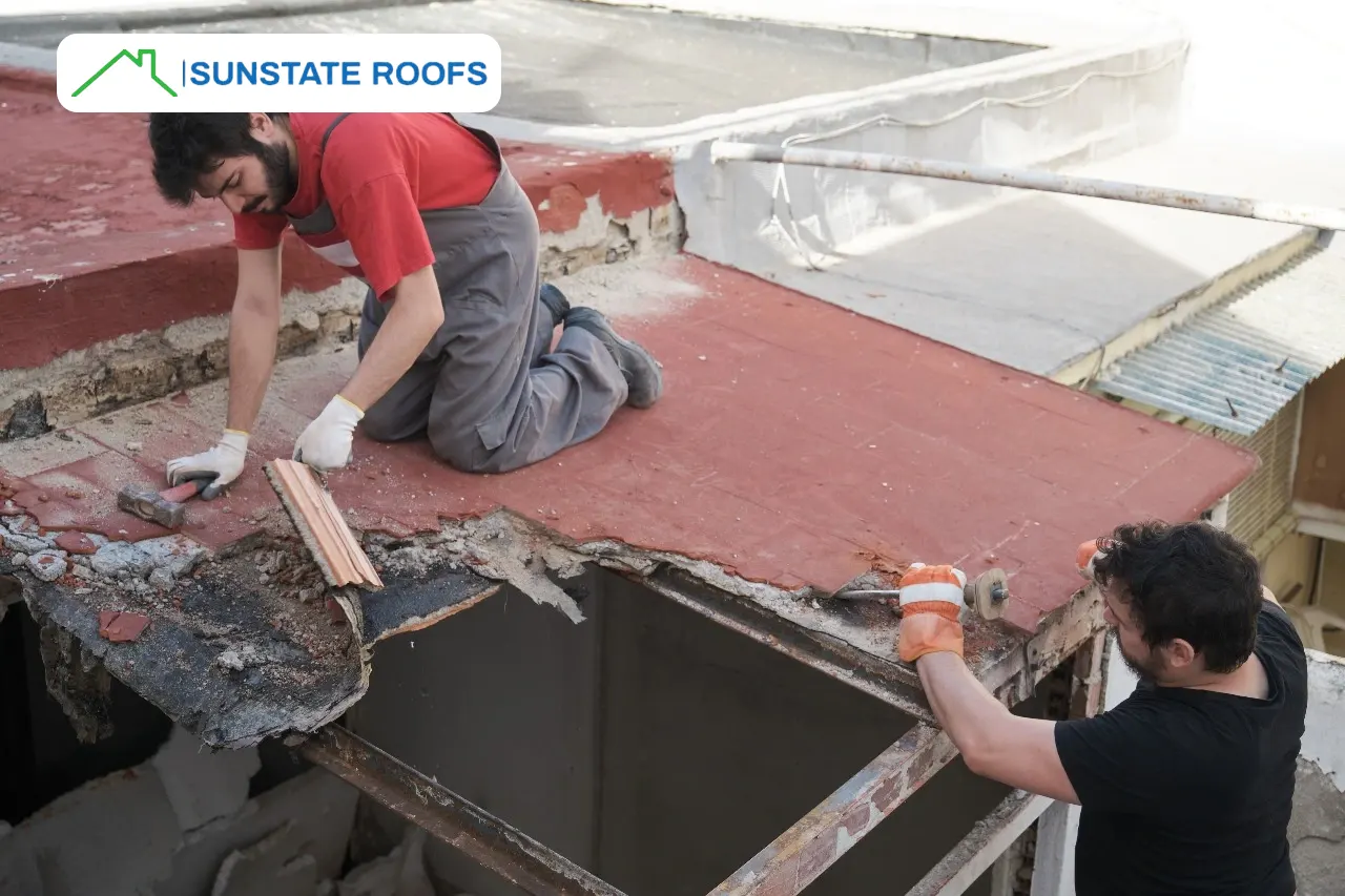 Roof repair in progress on a flat roof in Central Florida, addressing severe leaking roof damage. Highlights the importance of expert roof inspections, roof leak repairs, and durable solutions for residential Florida roofs, including metal and tile options