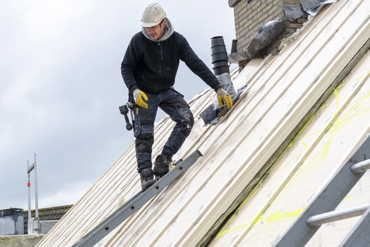 Roofing professional working on a roof replacement in Baldwin Park, FL, emphasizing services like roof inspections, repairs, replacements, and maintenance. Sunstate Roofs, a trusted roofing contractor, delivers reliable roofing solutions tailored to Baldwin Park homeowners' needs.