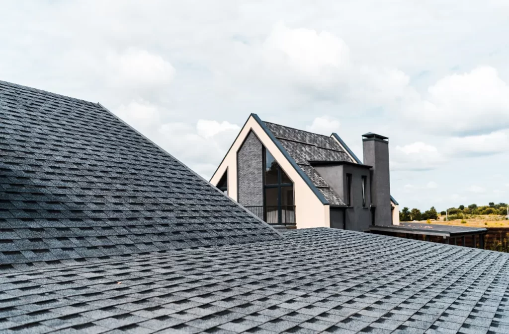 Newly installed shingle roof on a residential property by Sunstate Roofs in Central Florida, emphasizing residential services such as shingle roof replacement, shingle roof replacement process, and cost in Florida. Showcasing wind-resistant technology to protect homes against hurricanes and tropical storms