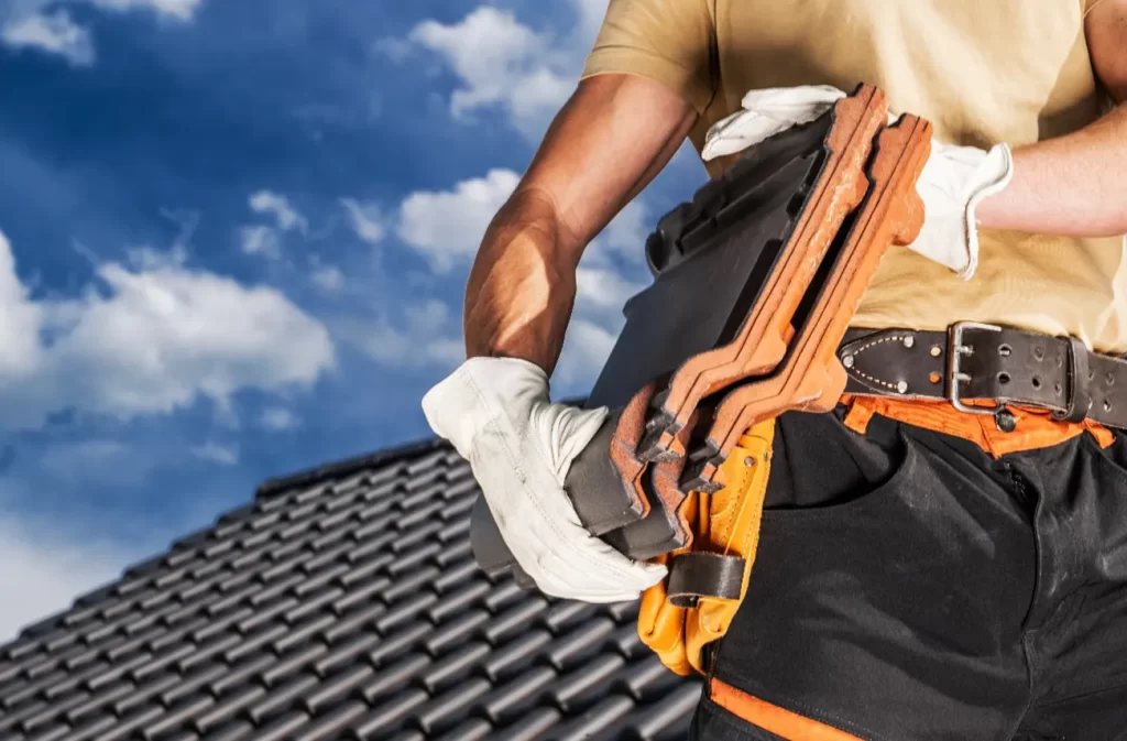 Sunstate Roofs professional installing tile roof replacement pieces on a residential roof in Central Florida. Highlighting the tile roof replacement process, cost-effective solutions, and durability for Florida homes, ensuring longevity and weather resistance.