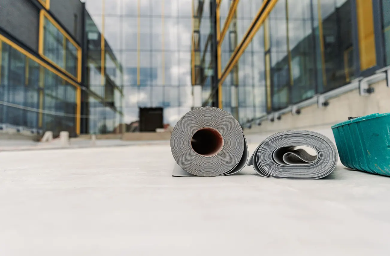 Close-up of TPO and EPDM roofing materials prepared for a commercial roof installation at an industrial site in Central Florida. Sunstate Roofs specializes in commercial services, including commercial roof installation and industrial roof installation, ensuring energy efficiency and durability for businesses.