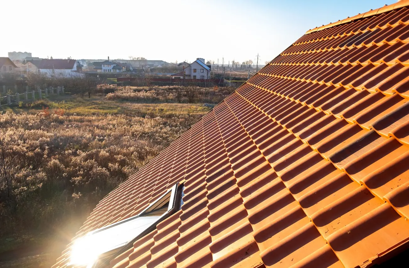 A sunlit residential roof with durable UV-resistant tiles, highlighting Sunstate Roofs' residential roof repair services in Central Florida. For trusted residential roof repair near me or residential roof repair Orlando, Sunstate Roofs ensures protection from Florida's intense heat and UV damage.