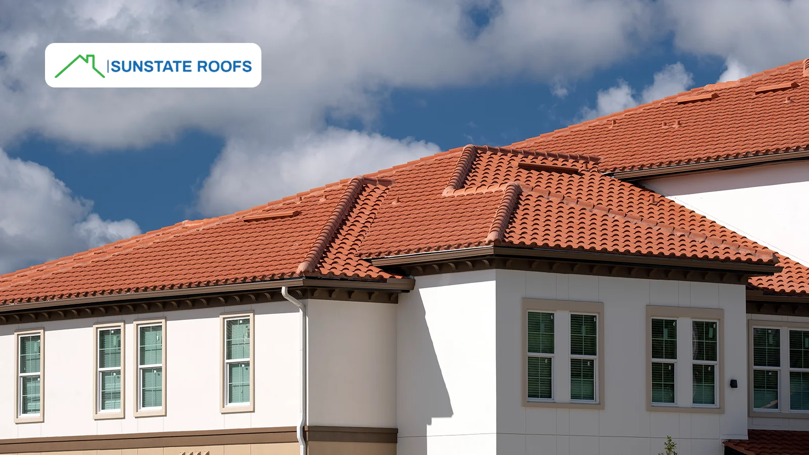 A beautiful home with a well-installed terracotta tile roof, showcasing the aesthetic appeal and longevity of residential roofing.