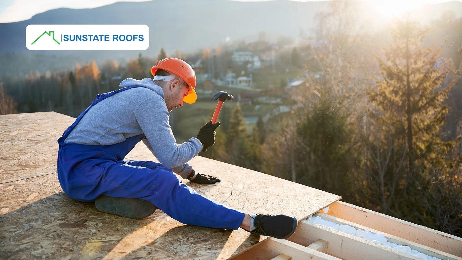 A roofing contractor working on a wooden roof deck during sunrise, showcasing professional craftsmanship and affordable roof repairs