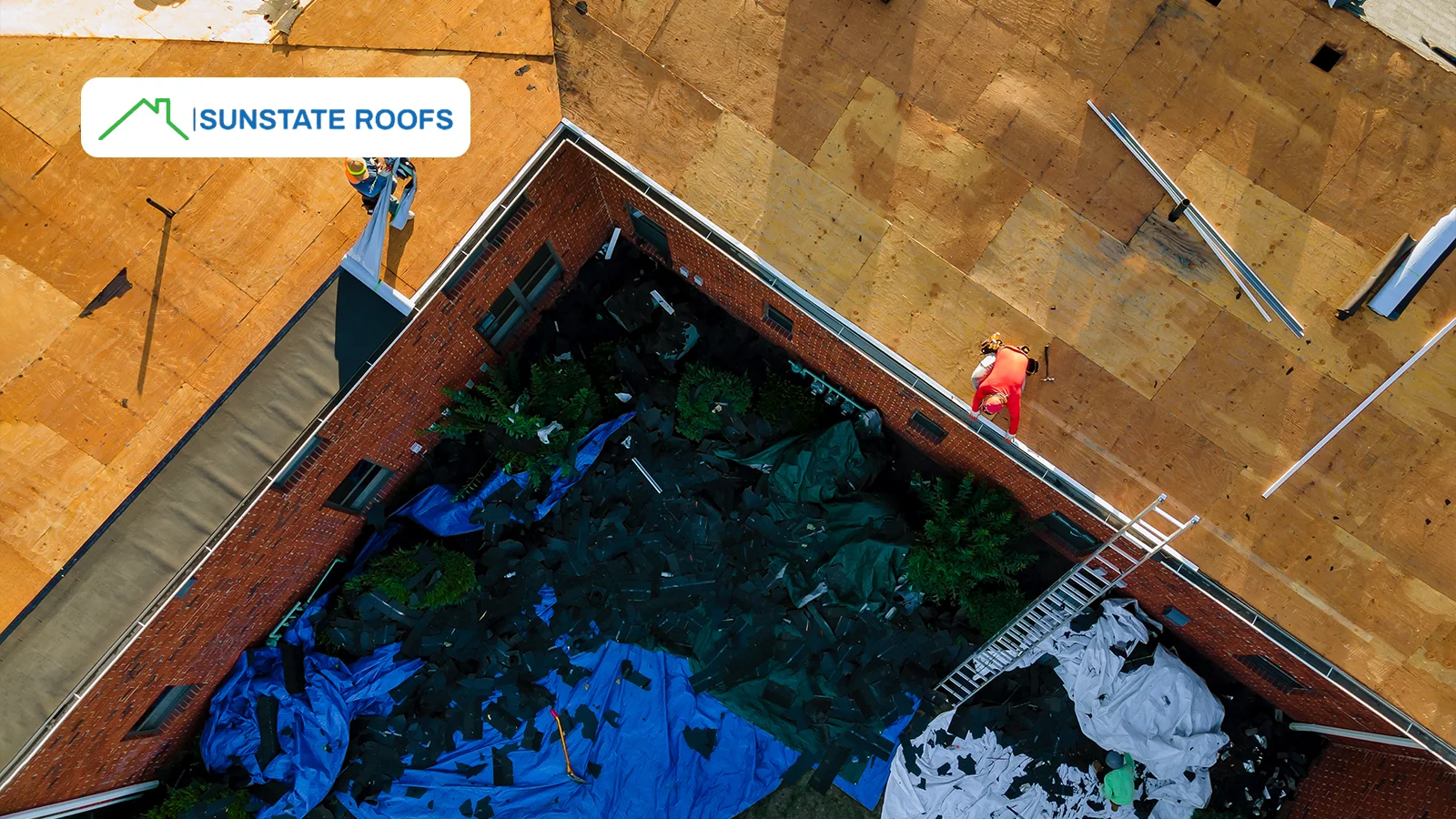 Sunstate Roofs team working on a damaged residential roof, providing expert emergency roof repairs to restore durability and protection.