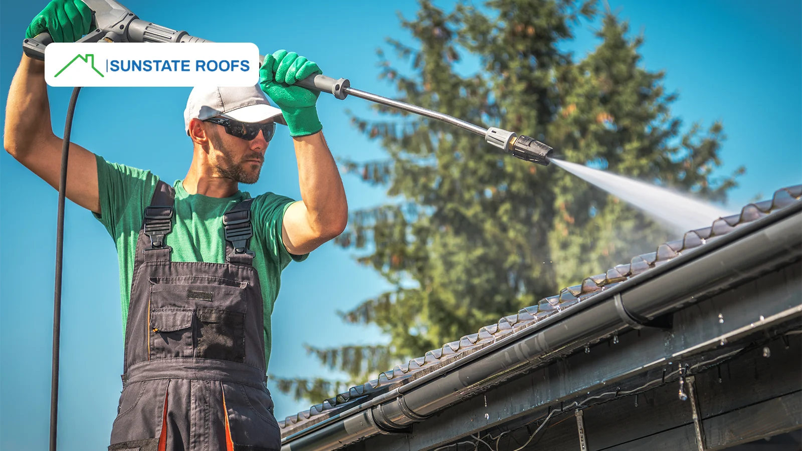 A professional performs high-pressure cleaning as part of routine commercial roof maintenance. Keeping a roof clean helps prevent debris buildup and extends its longevity.
