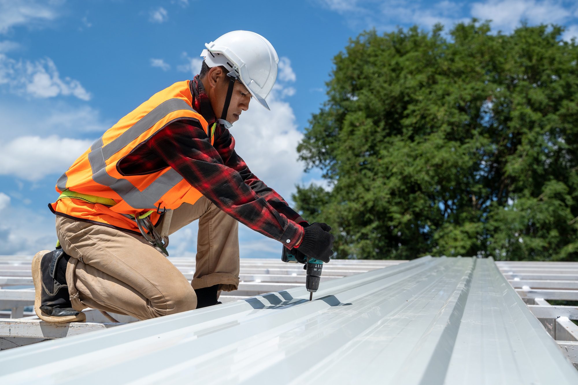 Roofing Contractor in Winter Springs installing a new roof structure, ensuring a durable and weather-resistant home.