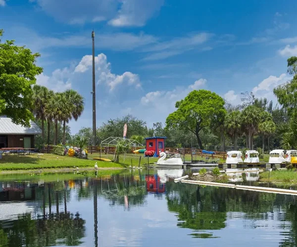 scenic waterfront view in Winter Park, FL, with clear blue skies and lush greenery, reflecting the charm of Central Florida. Sunstate Roofs, a leading roofing company and contractor, specializes in residential roofing and commercial roofing solutions tailored to Winter Park’s architecture.